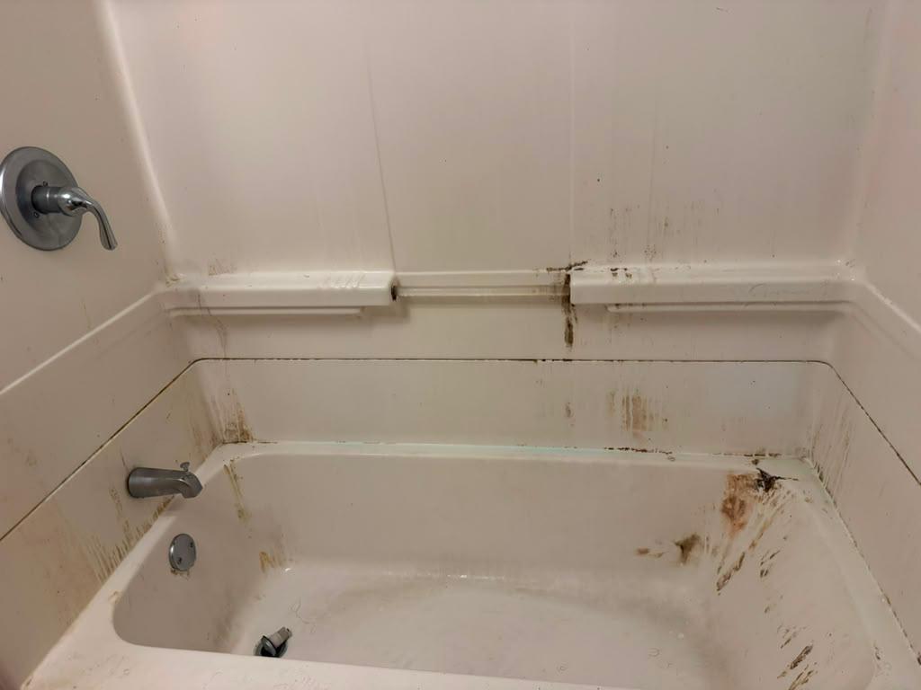 Bathtub and surround before cleaning